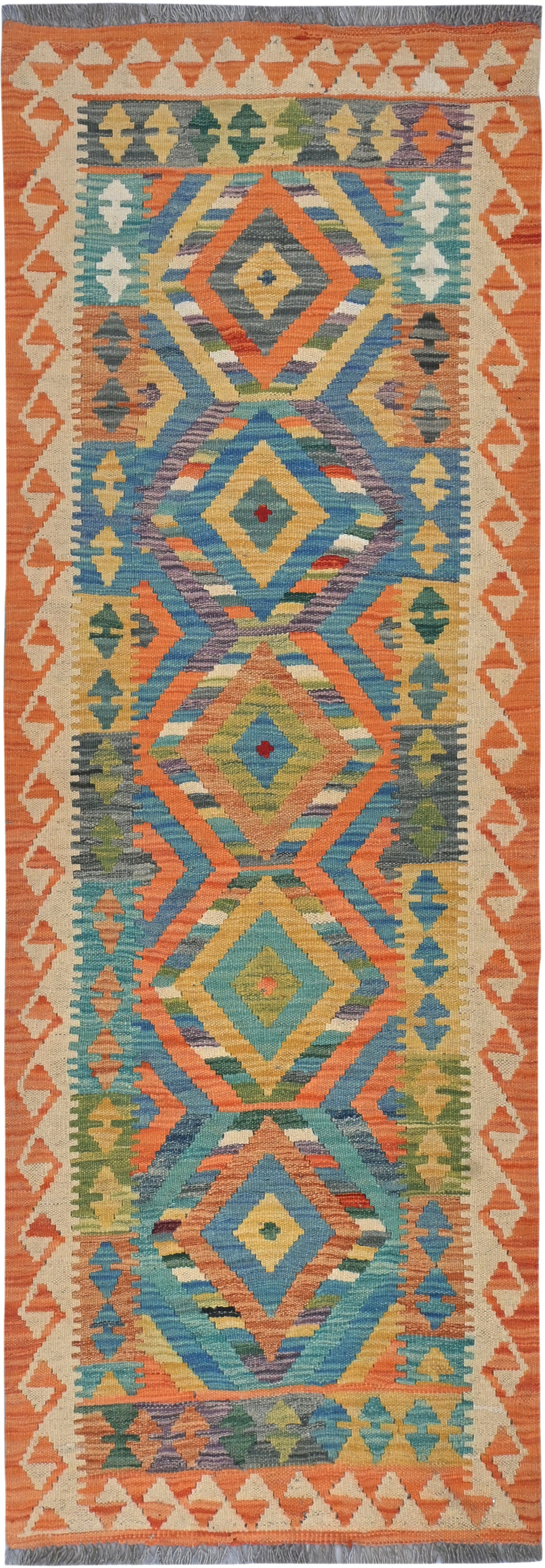 Colorful patterned rug with geometric design on a plain background