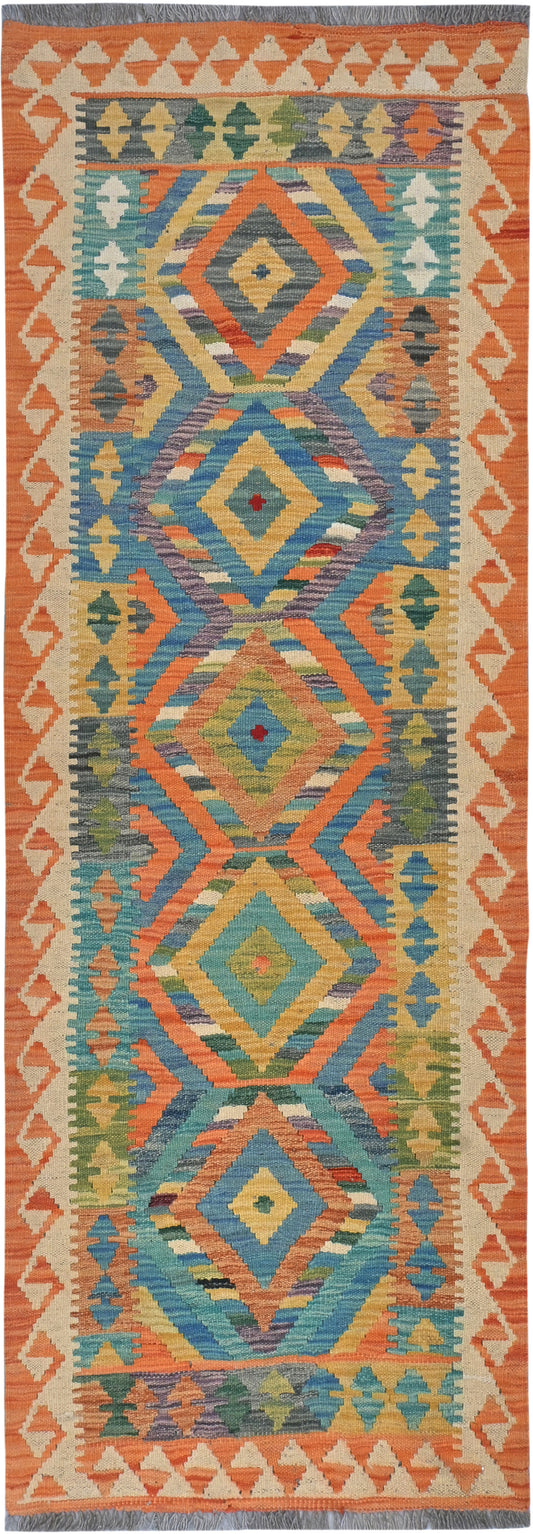 Colorful patterned rug with geometric design on a plain background