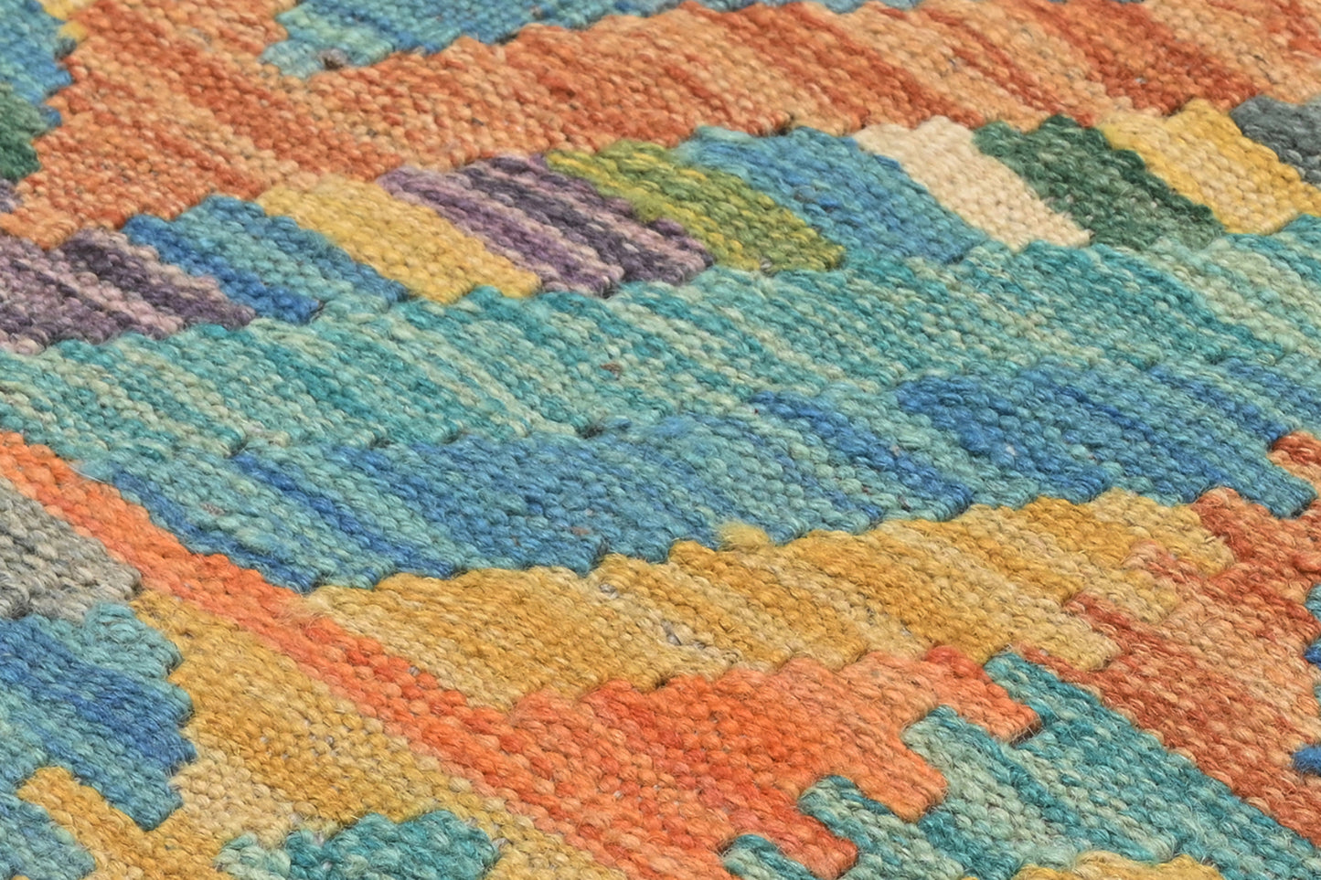 Close-up of a colorful woven textile with geometric pattern