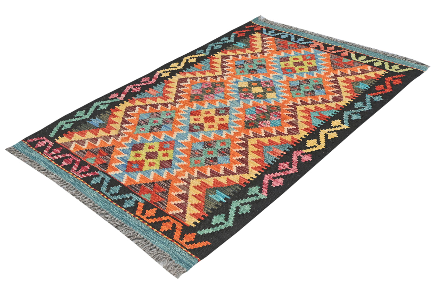 Colorful geometric patterned rug on a white background
