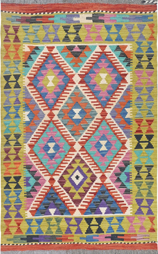 Multicolored geometric patterned rug with vibrant colors on a plain background