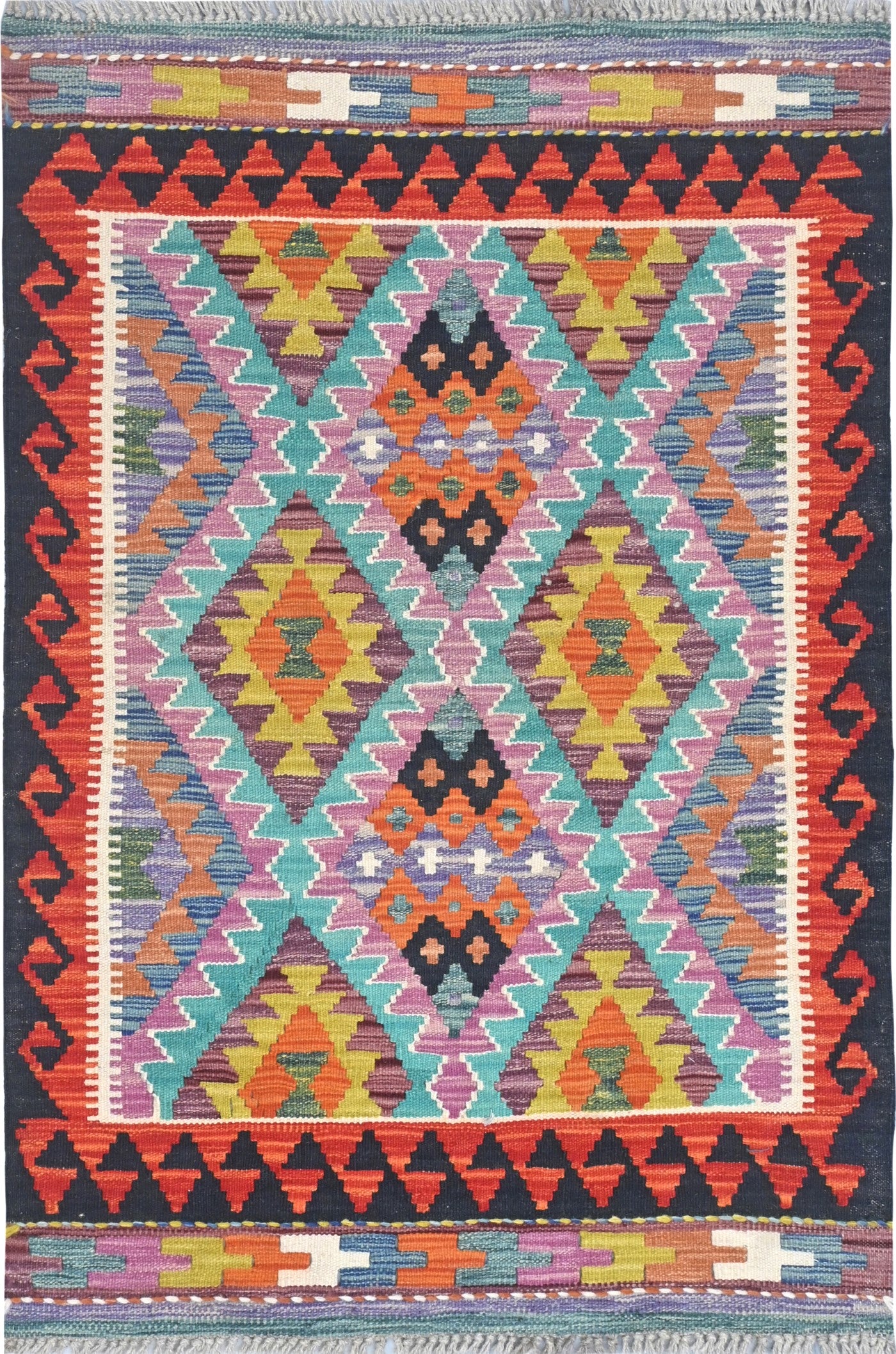 Colorful geometric patterned rug with vibrant colors on a dark background
