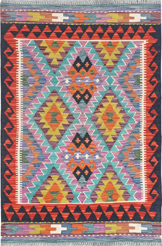Colorful geometric patterned rug with vibrant colors on a dark background