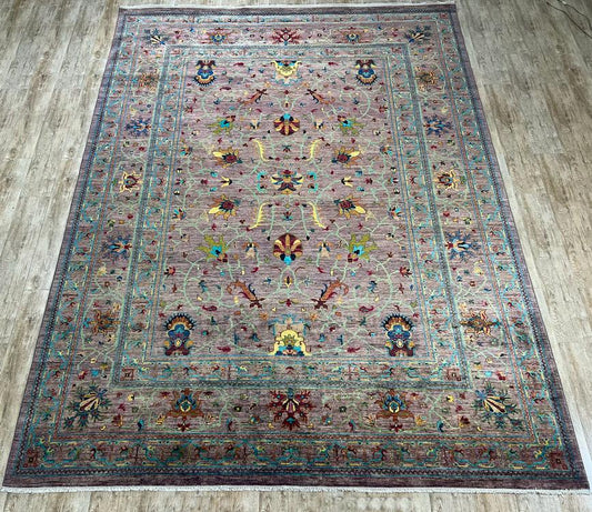 Decorative rug with intricate patterns on a wooden floor