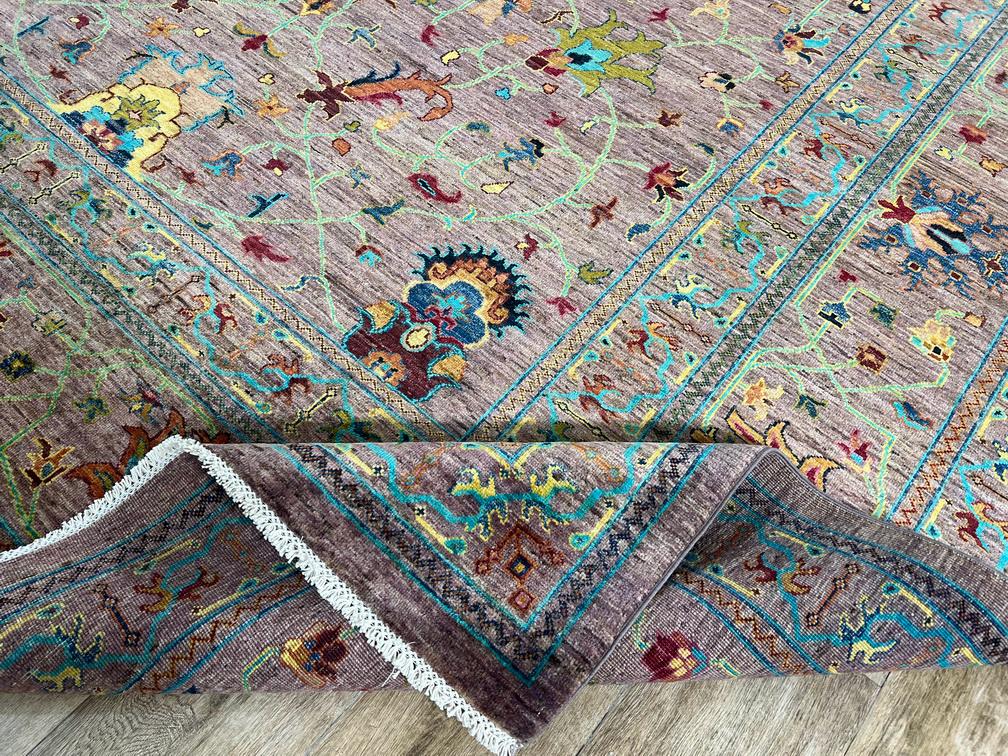 Decorative rug with intricate patterns on a wooden floor