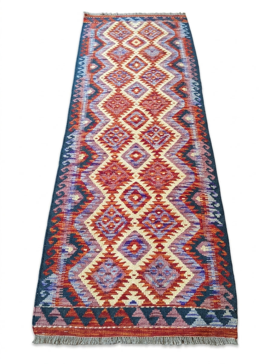 Eastofhere Kilim runner rug, 207x75cm, featuring traditional geometric patterns in vibrant colors on woven fabric.